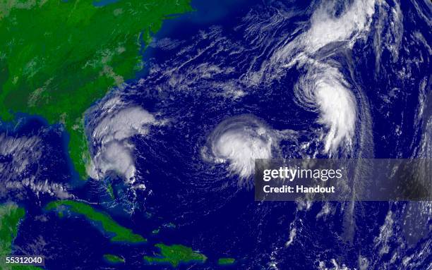 In this satellite illustration from NOAA, Tropical Depression Sixteen is shown off the coast of Florida along with Tropical Storm Nate , and...