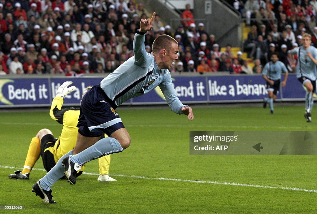 Scotland's Kenny Miller signals his fir