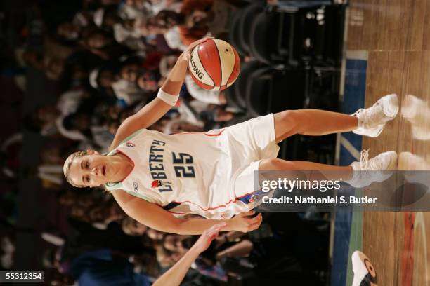 Becky Hammon of the New York Liberty handles the ball in Game One of the first round of the Eastern Conference playoffs against the Indiana Fever...