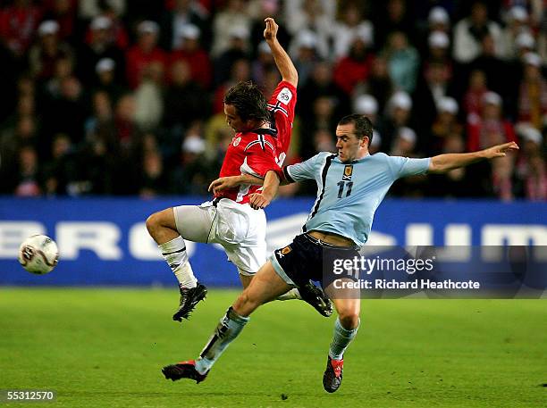 James McFadden of Scotland challenges Kristofer Haestad of Norway during the group 5 World Cup 2006 Qualifier between Norway and Scotland held at the...