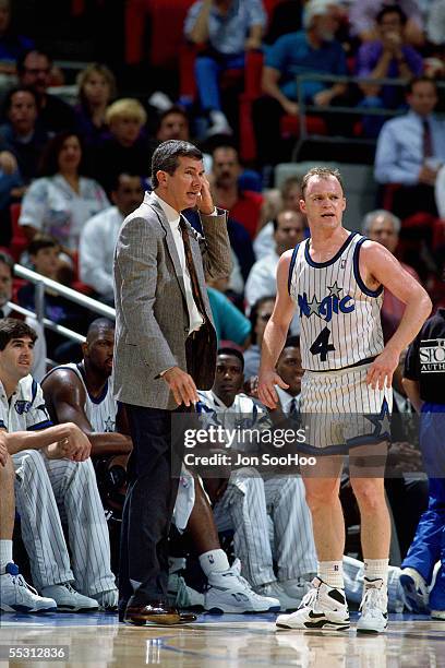 Head coach Matt Guokas of the Orlando Magic talks with Scott Skiles during a 1991 NBA game at TD Waterhouse Centre in Orlando, Florida. NOTE TO USER:...