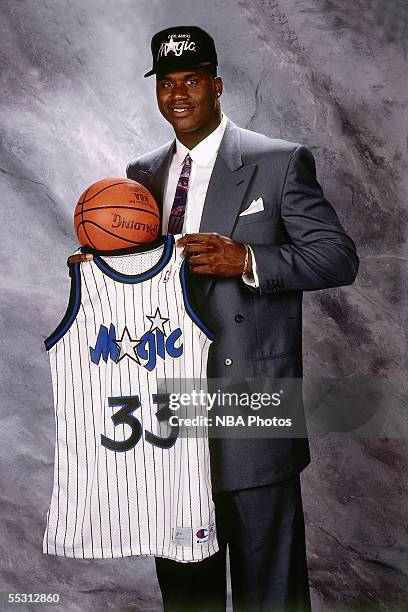 Shaquille O'Neal poses for a portrait with his Orlando Magic jersey after being drafted by the Orlando Magic with the first overall pick of the 1992...