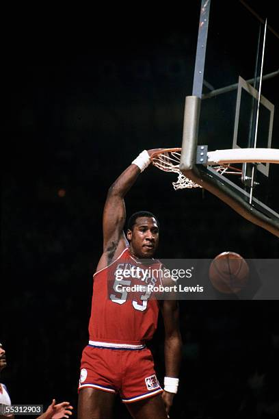 Darryl Dawkins of the Philadelphia 76ers dunks during a 1975 NBA game against the New York Knicks at Madison Square Garden in New York, New York....