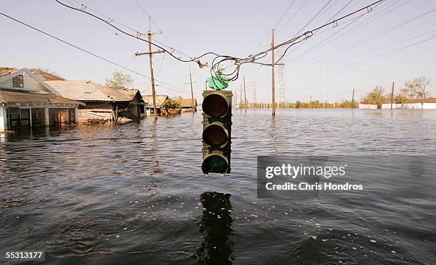 Traffic light hangs over floodwaters from Hurricane Katrina September 7, 2005 in New Orleans, Louisiana. The mayor of New Orleans ordered out the...