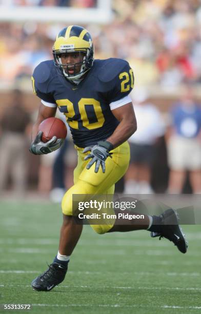 Running back Mike Hart of the Michigan Wolverines runs the ball against the Northern Illinois Huskies during the game at Michigan Stadium on...