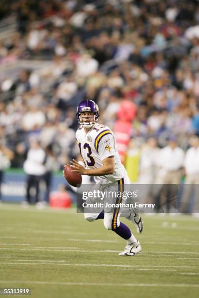 Quarterback Shaun Hill of the Minnesota Vikings rolls out to pass against the Seattle Seahawks during the preseason game on September 2, 2005 at...