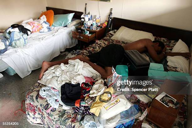 Man who lost his home sleeps in a ruined hotel September 7, 2005 in Bay St. Louis, Mississippi. Thousands of residents of the Gulf Coast are still...