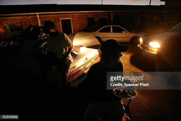Families that have lost their homes live in the parking lot of a ruined hotel September 7, 2005 in Bay St. Louis, Mississippi. Thousands of residents...