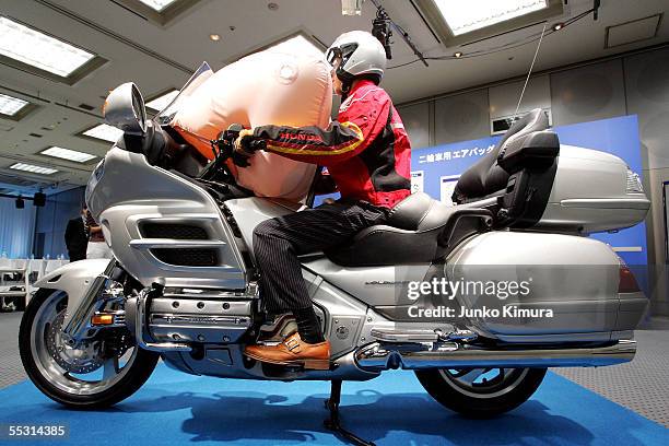 Honda Motor Co., Ltd.'s world's first production motorcycle airbag system is introduced at a press conference at Honda's HQ on September 8, 2005 in...