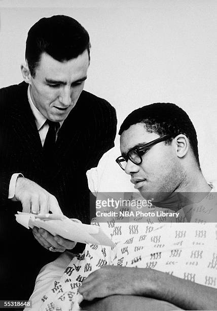 Maurice Stokes of the Cincinnati Royals talks over a few things with teammate Jack Twyman while resting in the hospital in 1958. NOTE TO USER: User...