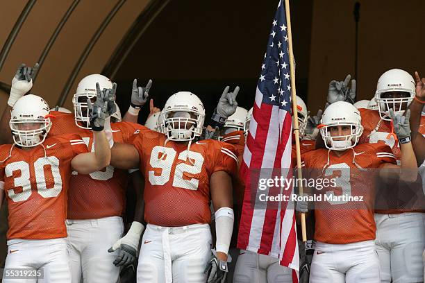 Texas Longhorns players Braden Johnson, Larry Dibbles and Karim Meijer stand in the tunnel before the game against the Louisiana-Lafayette Rajin'...