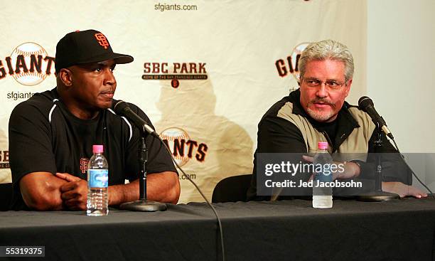 Barry Bonds and general manager Brian Sabean of the San Francisco Giants speak at a press conference before the game against the Chicago Cubs at SBC...