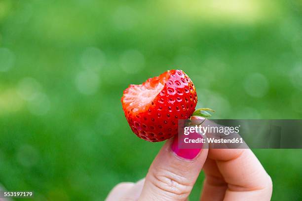 woman eating strawberry - bite mark stock pictures, royalty-free photos & images
