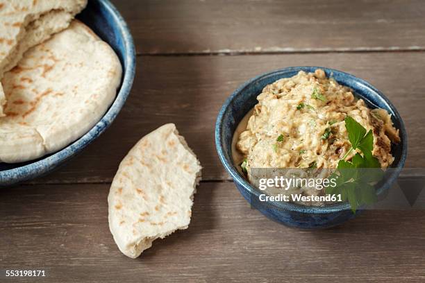 bowl of baba ghanoush with flat bread - tahini stock pictures, royalty-free photos & images