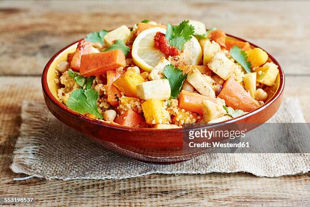 couscous with vegetables, including carrots, parsnips, pumpkin, shallots, apricots and chickpeas - クスクス ストックフォトと画像