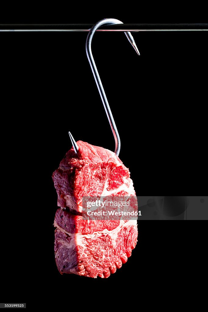 Raw beef on meat hook