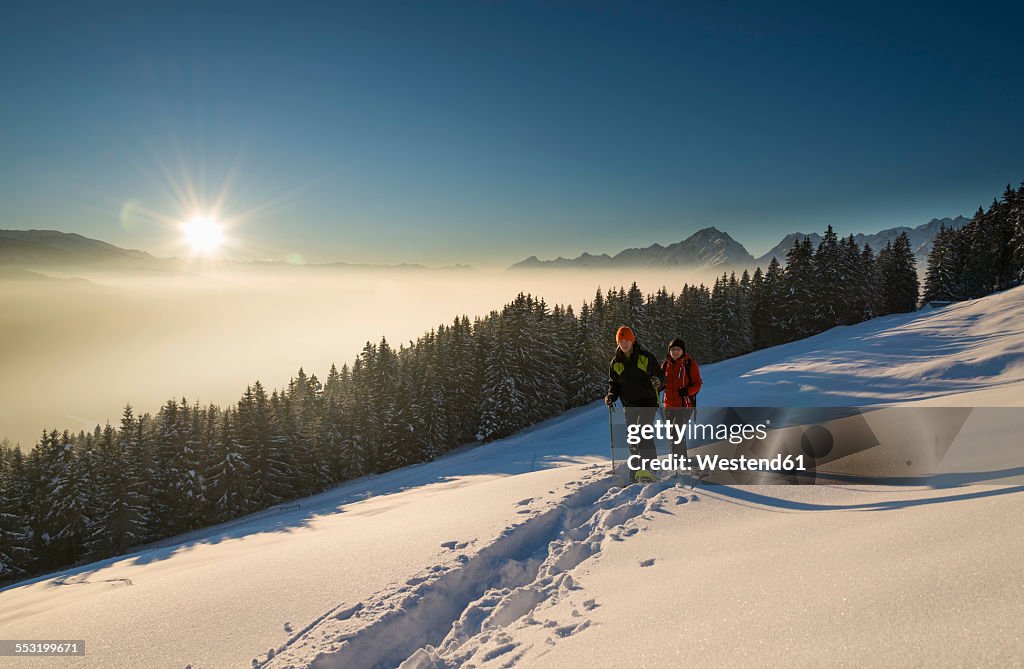 Austria, Tyrol, Schwaz, couple snowshoeing