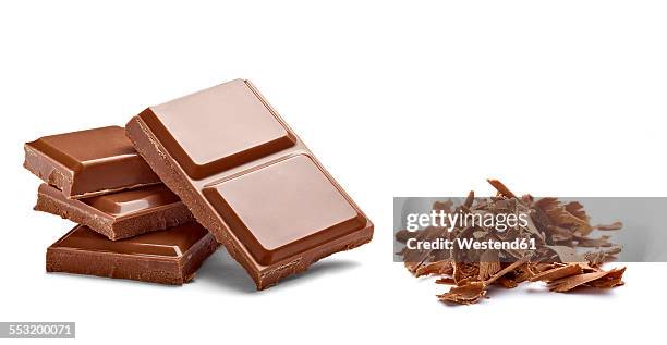 chocolate bar and chocolate shaving on white background - choclate bar stock-fotos und bilder