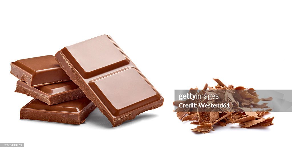 Chocolate bar and chocolate shaving on white background