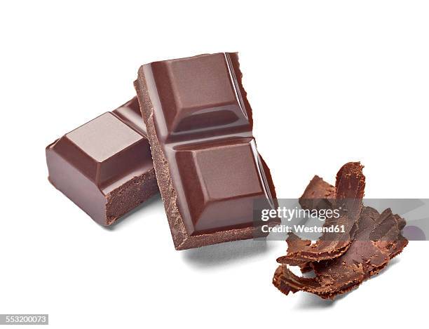 chocolate bar and chocolate shaving on white background - chocolate bar stock-fotos und bilder