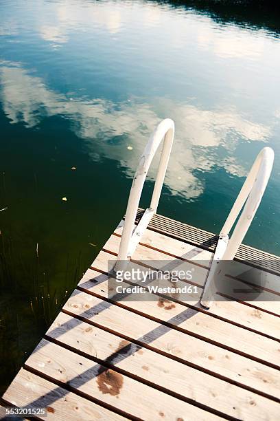 bathing jetty with two footprints - bathing jetty stock pictures, royalty-free photos & images