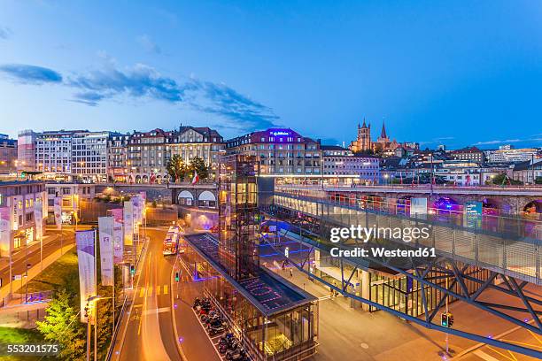 switzerland, lausanne, traffic in the city at dusk - lausanne cathedral notre dame stock pictures, royalty-free photos & images