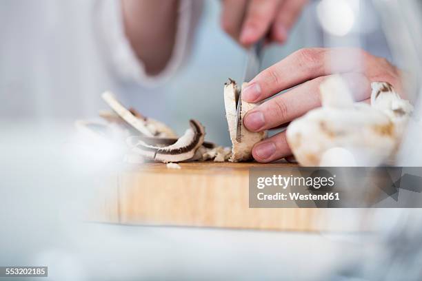 cutting mushrooms in kitchen - chopping stock pictures, royalty-free photos & images