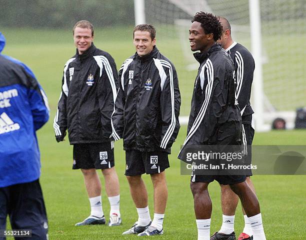 New signing Michael Owen in buoyant mood with teammates during training ahead of his debut performance for Newcastle United in this weekend's match...