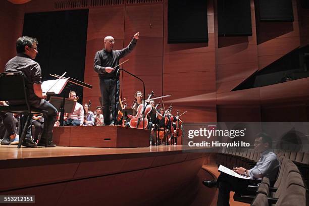 Young Juilliard composers and the conductor Jeffrey Milarsky with the Juilliard Orchestra in rehearsal at Alice Tully Hall on Tuesday morning, April...
