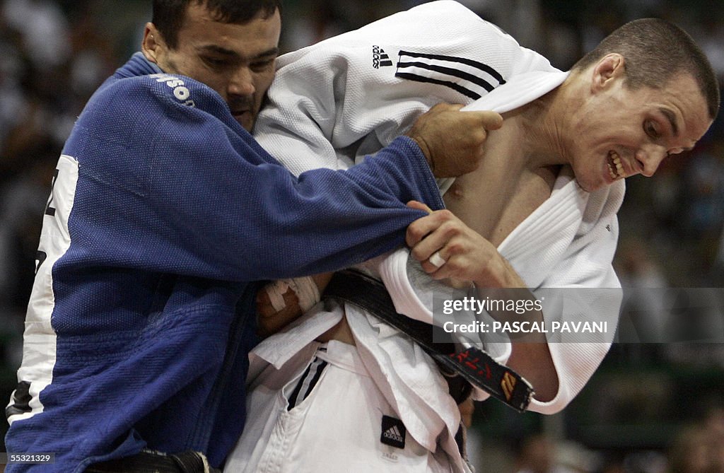 Uzbekistan's Laziz Yuldoshev (L) cometes