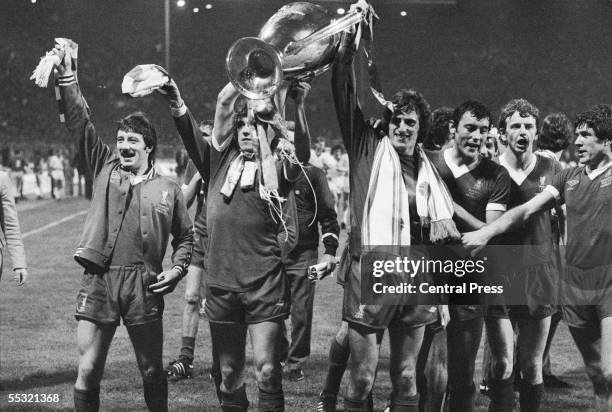 The players of Liverpool Football Club carry the trophy on a lap of honour after their 1-0 victory over FC Bruges in the European Cup final at...