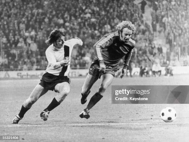 Sachse of Dynamo Dresden in action against Jonny Hansen of Bayern Munich in the second round, first leg of the European Cup at the Munich Olympic...