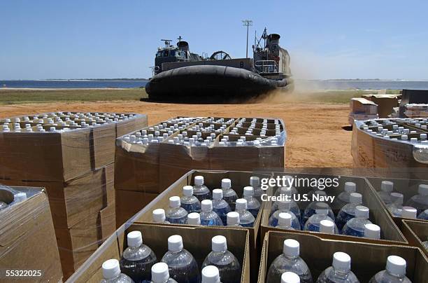 In this handout provided by the U.S. Navy, A U.S. Navy Landing Craft, comes ashore on Barrancas Beach aboard Naval Air Station Pensacola, Fla., to...