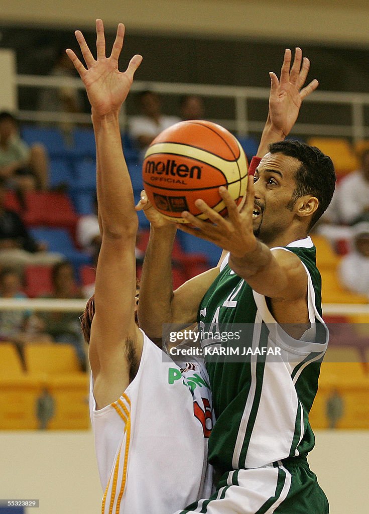 Adam Rasheed Samater Saudi Ahmad Samater in action against Chee Li Wei of Malaysia during ...