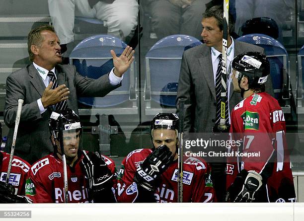 Head coach Hans Zach of the Haie gesticulates to Sebastian Furchner during the DEL match between Krefeld Pinguine and Koelner Haie on September 9,...