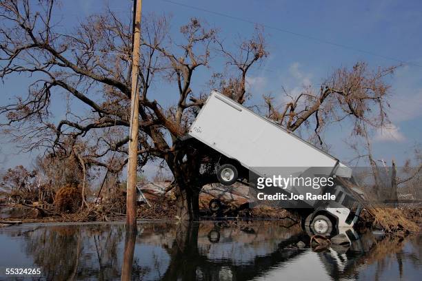 Truck hangs against a tree after Hurricane Katrina passed through, September 9, 2005 in Empire, Louisiana. Most of the area throughout the...
