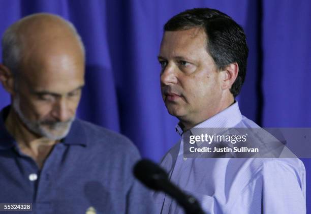 Chief Michael Brown looks on as Homeland Security Secretary Michael Chertoff speaks during a press conference September 9, 2005 in Baton Rouge,...