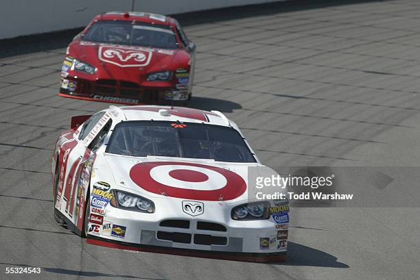 Casey Mears , driver of the Target/Lysol Dodge, and Kasey Kahne, driver of the Dodge Dealers/UAW Dodge, drive during practice for the NASCAR Nextel...