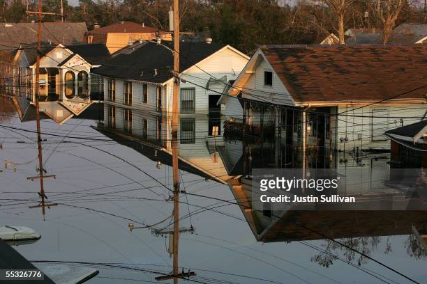 Houses are seen submerged under water September 9, 2005 in New Orleans, Louisiana. Thousands of residents of the Gulf Coast are still without...