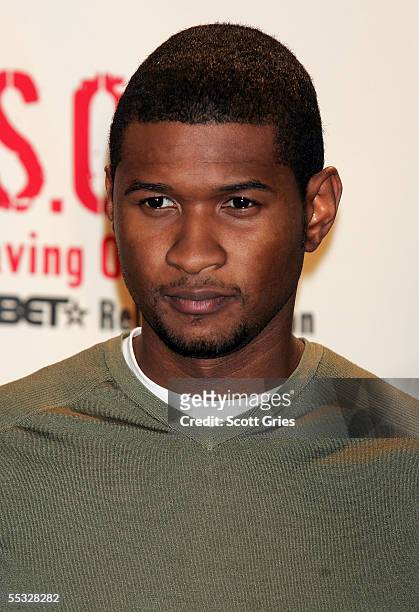Singer Usher poses for a photo backstage during "S.O.S. : The BET Relief Telethon" to benefit the victims of hurricane Katrina at the BET Studios...
