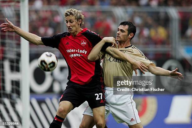 Stefan Kiessling of Nuremberg fights for the ball against Willy Sagnol of Munich during the Bundesliga match between 1. FC Nuremberg and Bayern...