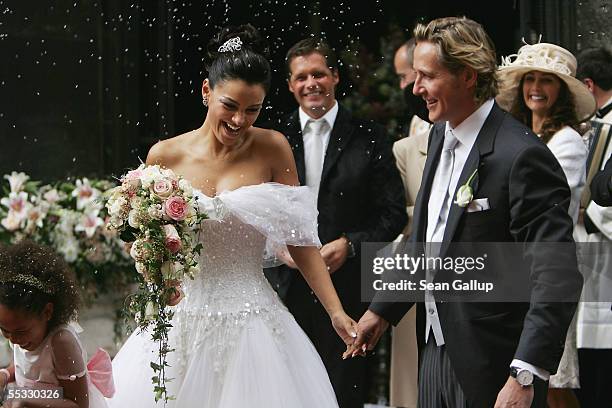 German television personality Verona Pooth and her husband Franjo Pooth are showered with rice after their wedding at the Stephansdom catherdral...
