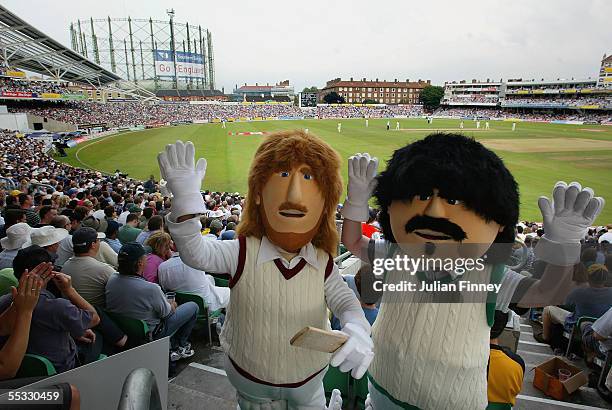 Fans wearing dressed as the characters "Beefy" and "Lamby" wave as they enjoy day three of the fifth npower Ashes Test match between England and...