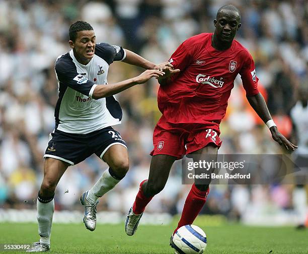Jermaine Jenas of Tottenham Hotspur challenges Momo Sissoko of Liverpool during the Barclays Premiership match between Tottenham Hotspur and...