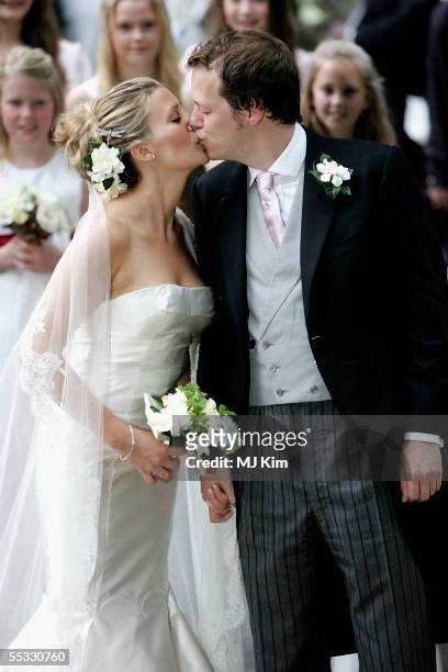 Tom Parker Bowles kisses his new wife Sara as they leave their ceremony in St. Nicholas Church, Henley-on-Thames on September 10, 2005 in...