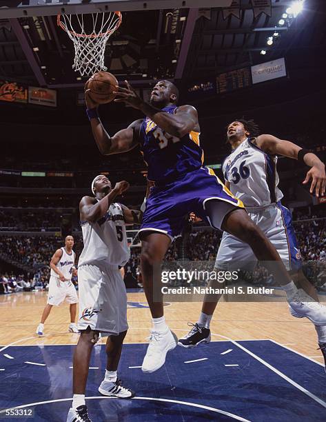 Center Shaquille O''Neal of the Los Angeles Lakers shoots a layup during the NBA game against the Washington Wizards at the MCI Center in Washington,...