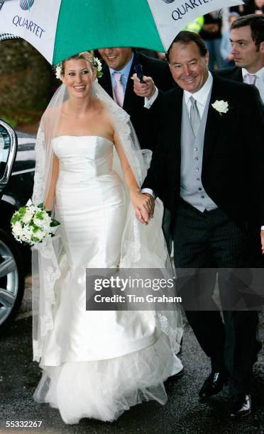 Sara Buys walks with her father at her wedding to Tom Parker-Bowles. Their marriage was held at St. Nicholas Church at Rotherfield Greys in...