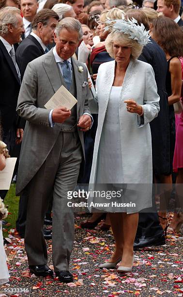 Prince Charles, Prince of Wales, Camilla, Duchess of Cornwall and Camilla's ex husband, Andrew Parker- Bowles, leave the wedding of Tom Parker-Bowles...