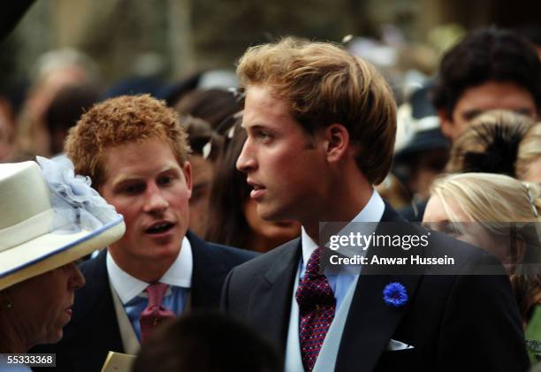 Prince William and Prince Harry leave the wedding of Camilla, Duchess of Cornwall's son, Tom Parker-Bowles, to Sara Buys on September 10, 2005 in...