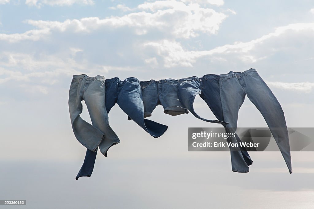 Jeans hanging on a clothesline in the wind